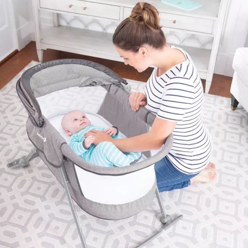 Infant rocking outlet bassinet