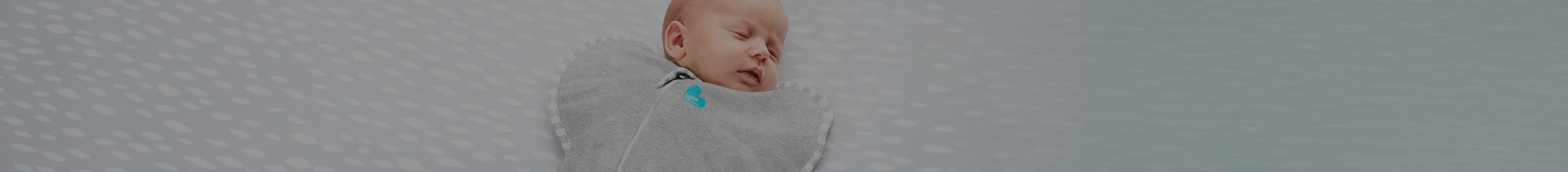 Baby sleeping in the innovative Love To Dream SWADDLE up sleep sack