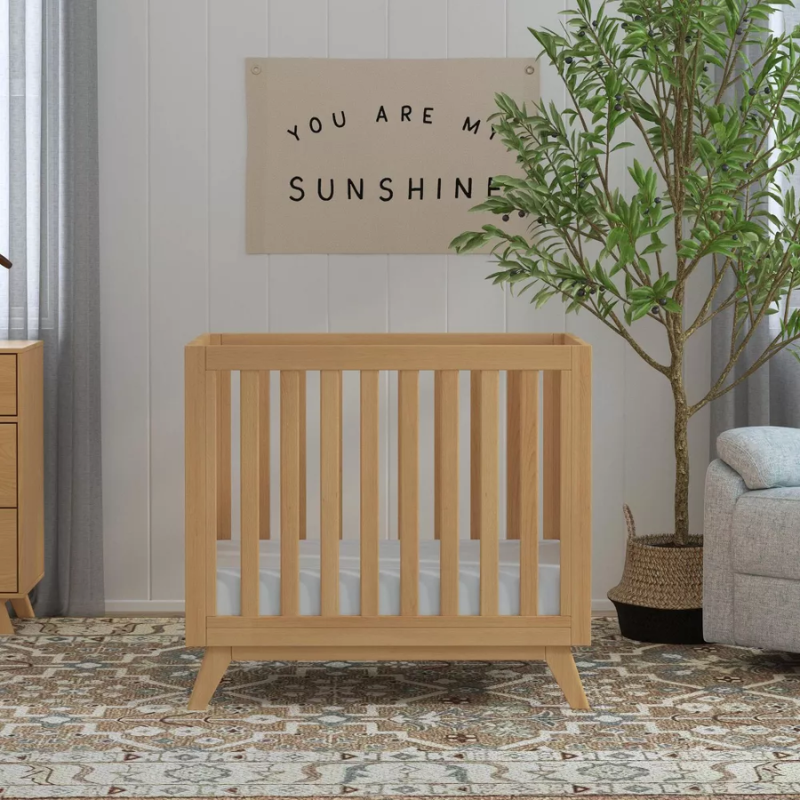 Otto 3-in-1 Convertible Mini Crib - Honey by DaVinci Baby at $429! Shop now at Nestled by Snuggle Bugz for Cribs.