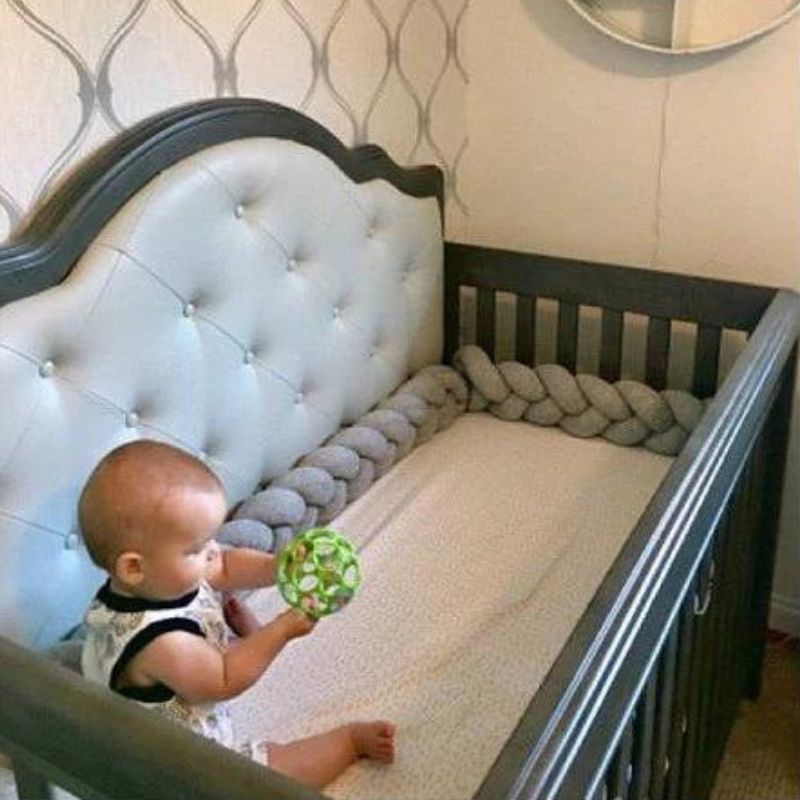 Baby bumps head in crib best sale