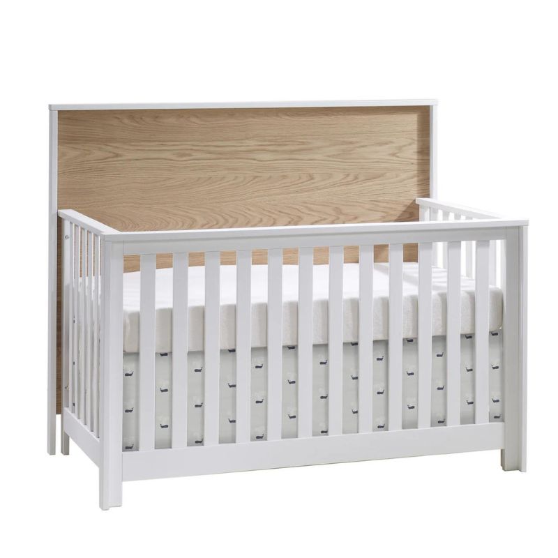 Vibe 5-in-1 Convertible Crib by Nest by Natart at $959! Shop now at Nestled by Snuggle Bugz for Cribs.