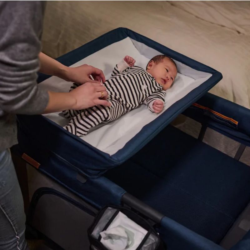 Playard with changing outlet table